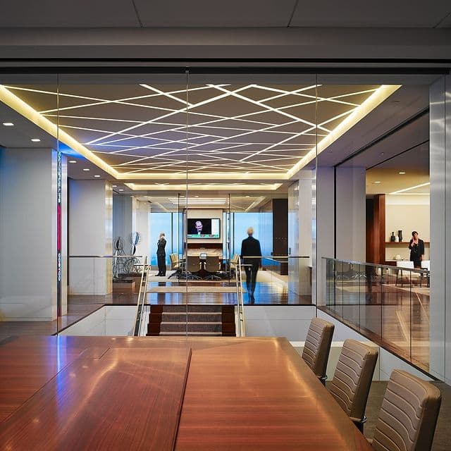 Artistic geometric pattern ceiling lighting in an office environment